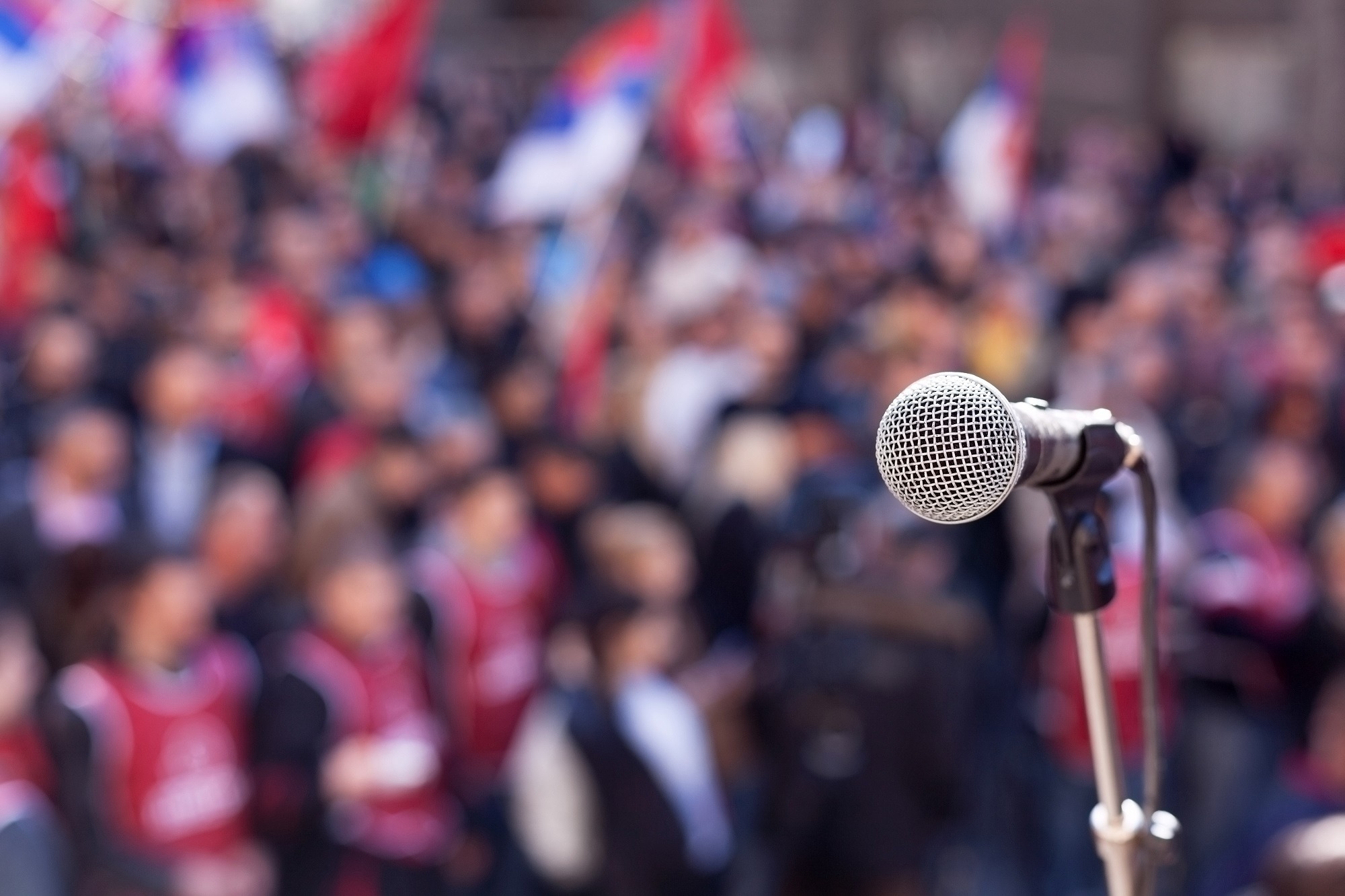 Microphone focused in front of a crowd